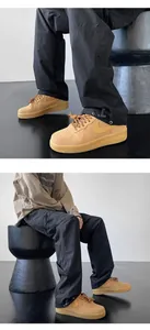 Detail of black technical cargo pants with adjustable drawstring hem for outdoor activities.