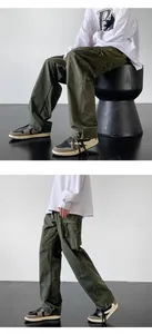 Detailed view of olive green functional cargo pants for outdoor mountain climbing
