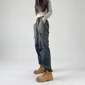 View of women's fleece-lined waterproof hiking cargo pants in functional style