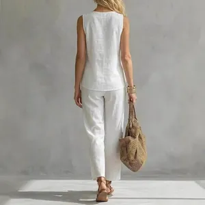 Elegant white sleeveless linen shirt and matching trousers set for women back view
