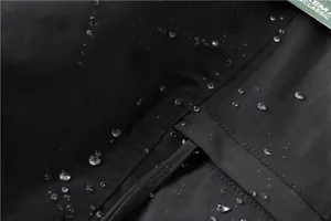 Macro view showing the waterproof fabric detail of men's black cargo pants