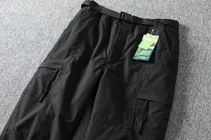 Detail of men's windproof softshell cargo pants with belt and functional side pocket