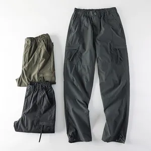 Men's multi-pocket cargo pants with elastic waist and drawstring cuffs in multiple colors