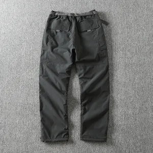 Back view detail showing pockets of men's windproof winter softshell cargo pants