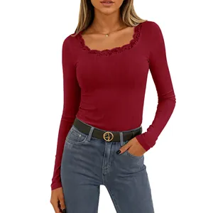Detail of maroon long sleeve ribbed top featuring delicate lace trim on square neckline
