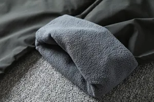 Close-up of the warm fleece lining in waterproof outdoor softshell cargo pants for men