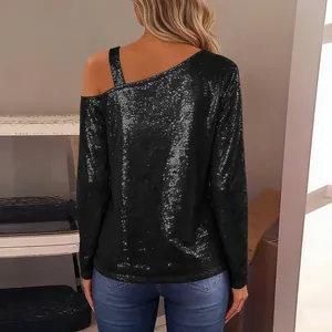 Rear view of a black sequined long-sleeve top featuring cold-shoulder strap design