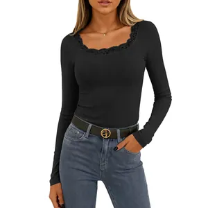 Detailed view of women's black square neck ribbed long sleeve top featuring lace trim