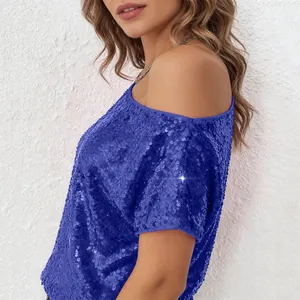Close-up of royal blue sequin off-shoulder top showing shimmering texture and casual fit