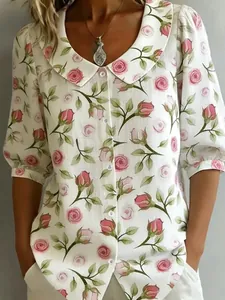 Close-up of vintage Peter Pan collar blouse with romantic pink rose floral pattern