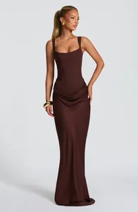 Elegant brown corset bodycon maxi dress with draped hip detail and floor length hem.