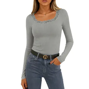 Detailed view of grey ribbed fabric and delicate lace trim on the square neck t-shirt