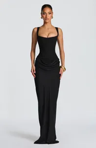 Elegant black corset maxi dress with draped waist detail and floor-length silhouette