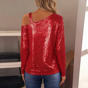 Detailed back view of a glamorous red sequined long sleeve top with unique one-shoulder strap