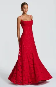 Close-up of elegant red textured jacquard long dress worn by a fashion model.