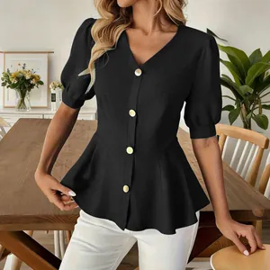 Close-up of elegant black puff sleeve V-neck peplum blouse showing fit and gold buttons