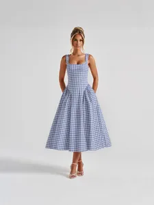 Elegant French style blue and white gingham midi dress with square neckline and flared skirt.