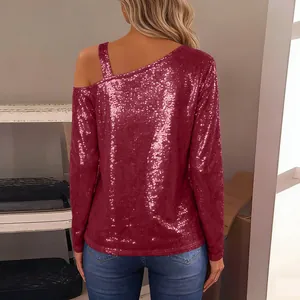 Back view of burgundy sequined long sleeve top with unique off-the-shoulder strap design