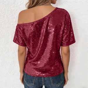 Back view detail of a wine red sequined one-shoulder top with a shimmering finish