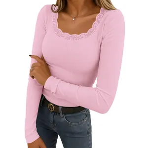 Detail view of a pink ribbed long sleeve top featuring delicate lace at square neck