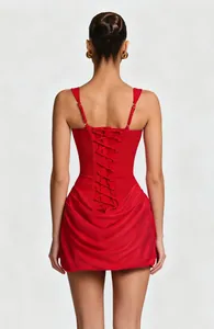 Back detail of red sleeveless bodycon mini dress with lace-up corset and draping