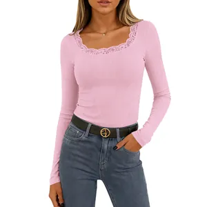 Detail view of pink long sleeve ribbed top with delicate lace trim square neckline.