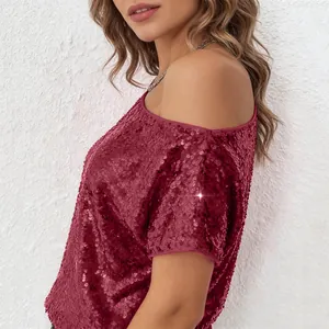 Detail view of sparkly wine red sequined off-shoulder top for a glamorous party look.