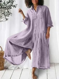 Detail of a casual purple cotton linen jumpsuit featuring long sleeves and button front