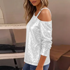 Detailed side view of white sequined cold shoulder top with elegant long sleeves.