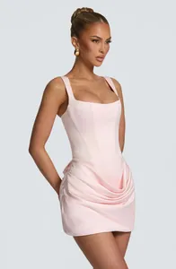 Elegant pink square-neck mini dress with corset bodice and ruched skirt details.