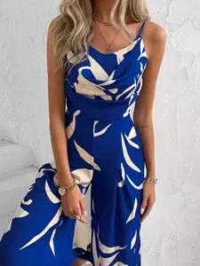 Chic blue and white patterned wide-leg sleeveless jumpsuit with stylish draped neckline