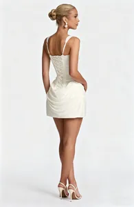 Detailed back view of an elegant white square neck mini dress with corset lace-up and draped skirt.