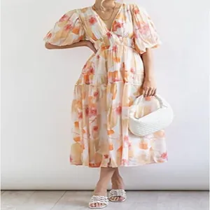 Vestido midi floral bohemio con mangas abullonadas y elegante detalle de cintura fruncida