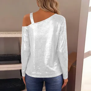Back view of the silver sequined long sleeve top with cold shoulder strap detail.