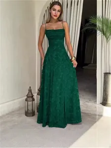 Elegant dark green camisole maxi dress featuring a textured floral pattern and A-line silhouette