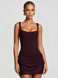 Close-up view of a chic burgundy square neck sleeveless dress with draped corset design