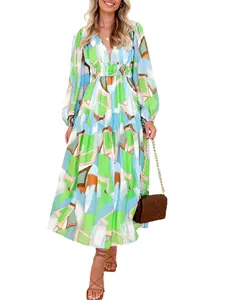 Elegant Bohemian long sleeve maxi dress featuring a deep V-neck and vibrant geometric print