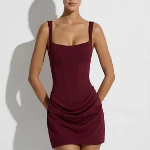 Detailed view of burgundy square neck sleeveless dress with ruched bodycon skirt