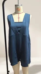 Front view of a dark blue sleeveless V-neck romper displayed on a dress form mannequin