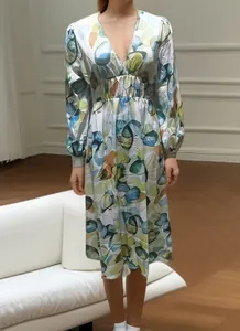 Bohemian printed midi dress with deep V-neck and high waist design details.
