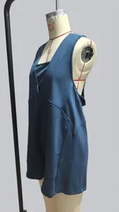 Detailed side view of a navy blue sleeveless V-neck romper on a factory mannequin