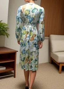 Back view of a bohemian midi dress with colorful abstract pattern and elastic waist.