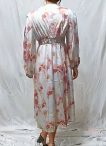 Back view detail of bohemian high waist midi dress with abstract pink floral print.