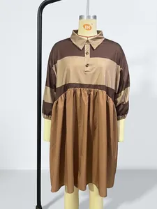 Detailed macro view of a brown striped polo collar dress displayed on a mannequin