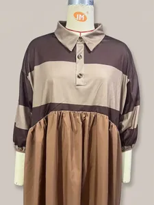 Detail of casual color-blocked striped polo dress with collar buttons and pleated skirt