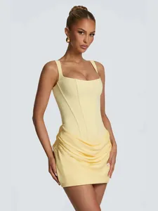 Elegant yellow square neck sleeveless mini dress with corset bodice and draped skirt