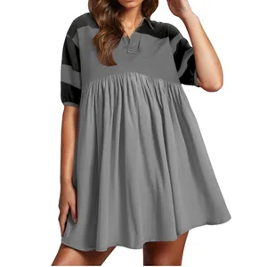 Fashionable women's short sleeve polo dress featuring unique patchwork and pleated skirt design
