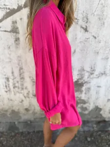 Side view of vibrant magenta long sleeve oversized cotton linen shirt for women