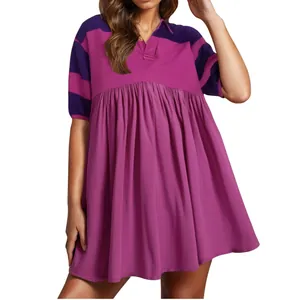Detailed shot of a stylish short-sleeved polo dress featuring striped top and pleated skirt