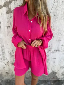 Vibrant fuchsia cotton linen two-piece set featuring long-sleeved shirt and shorts.